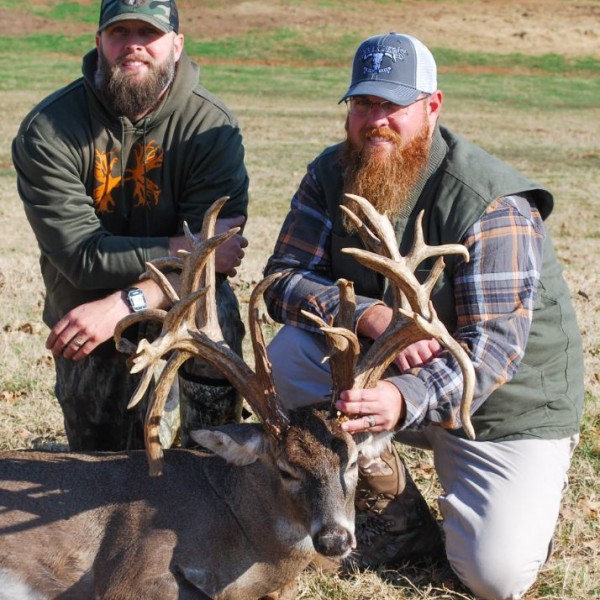 Two men holding up trophy whitetail deer in Texas